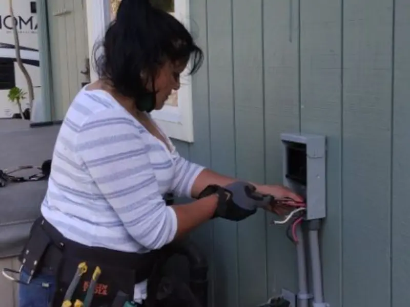 Licensed electrician wiring an exterior subpanel in Santa Rita Ranch