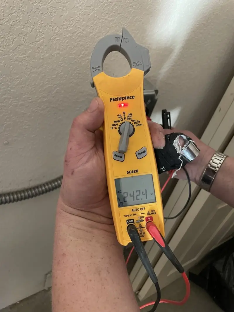 Voltage testing with clamp meter during Circuit Breaker Repair in Santa Rita Ranch